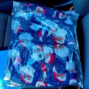 Brand new still inplastic Christmas pajamas. Size medium. Button front shirt